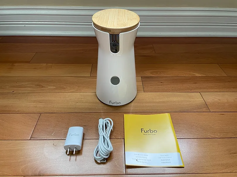 furbo 360 dog camer and accessories on the floor