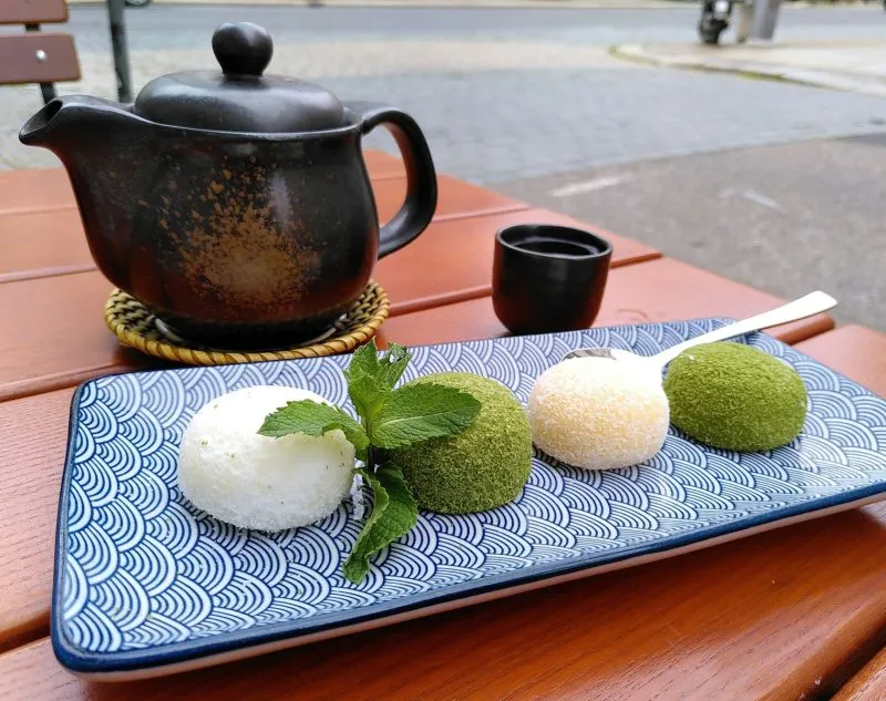mochi cakes on the table with tea pot