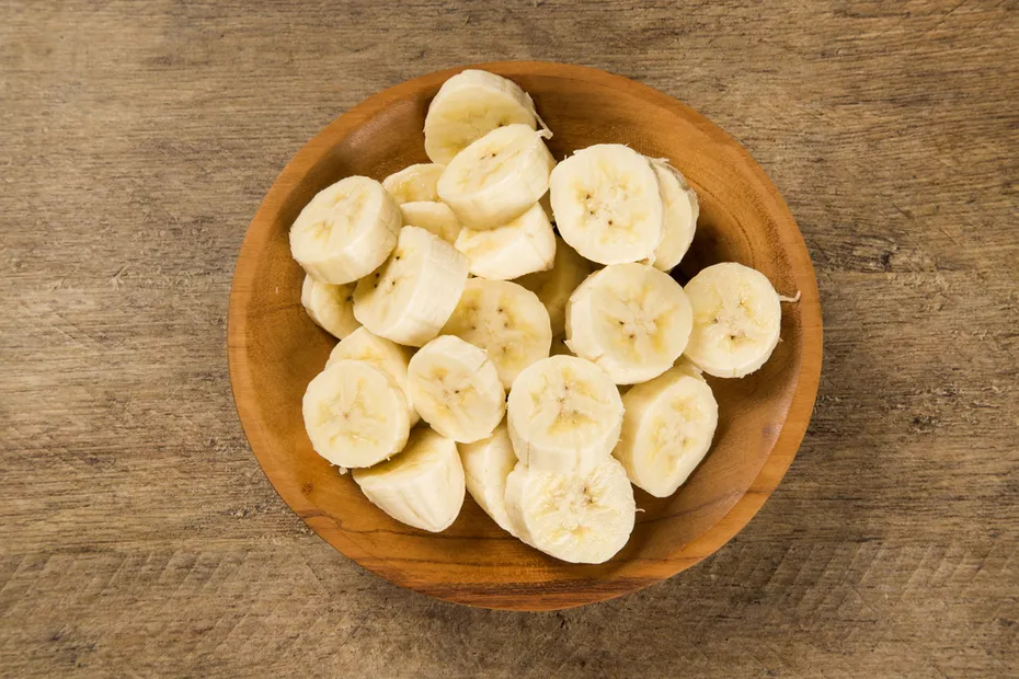 sliced banana in a pot over a table