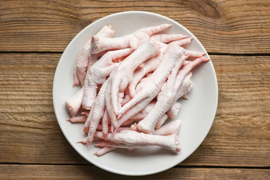 chicken feet on white plate