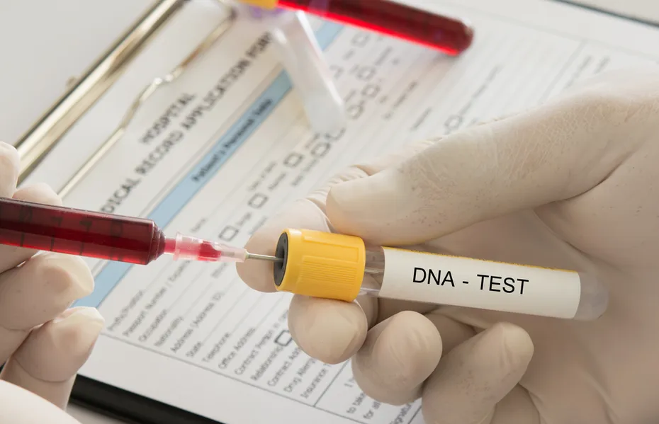 doctor uses a syringe blood sample into dna test tube in the laboratory