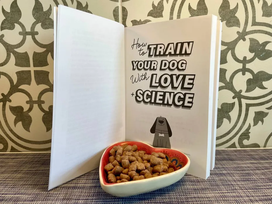 How to Train Your Dog with Love + Science Book Review - book with treats