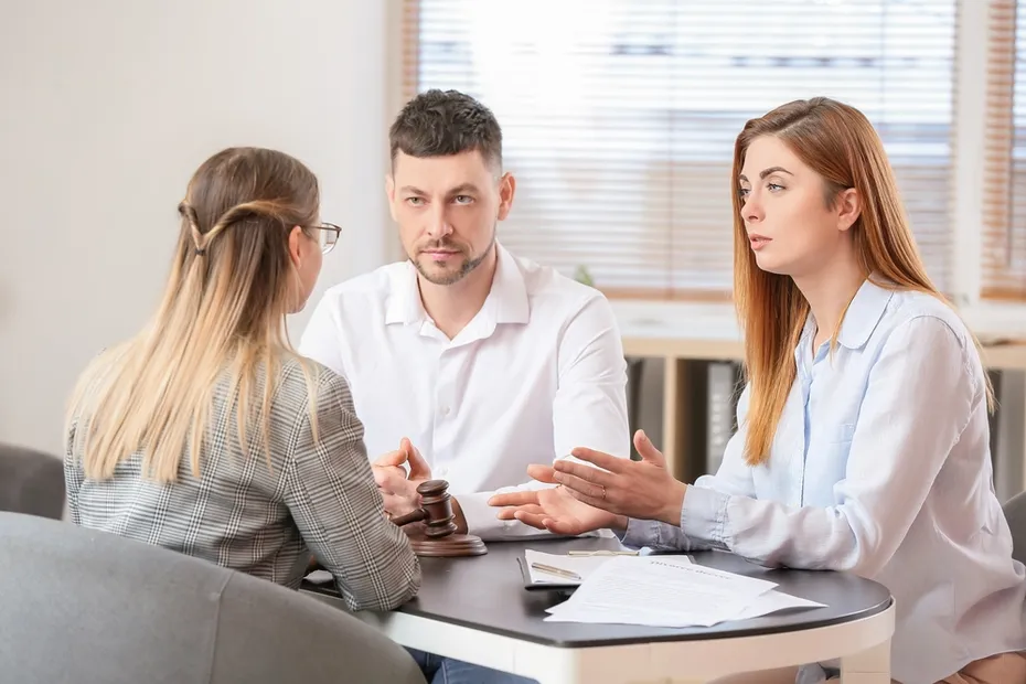 couple talking to a lawyer at the office