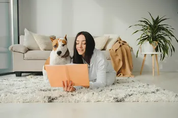Girl,Reading,A,Book,With,Her,Dog,Beside,Her.,Woman