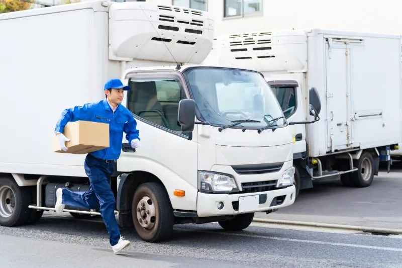 postal worker parking the truck and running with the luggage