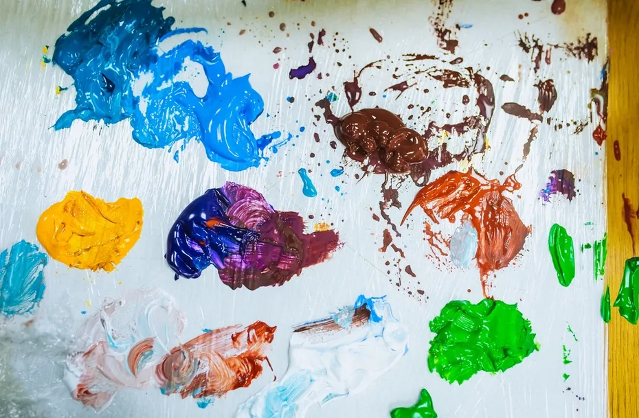 Bright-colored paints on a canvas