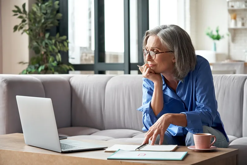 Senior mature older woman watching business training