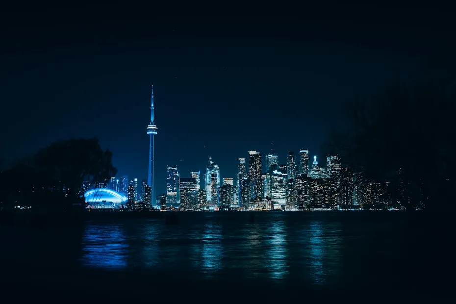 Toronto, Ontario a view of a city at night from across the water