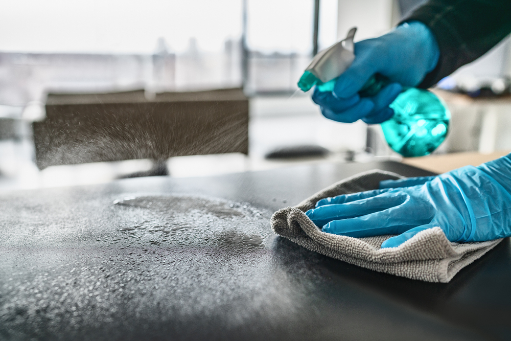 cleaning-the-surface-with-spray-bottle