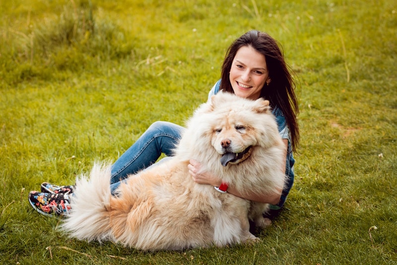 woman with her dog in the park