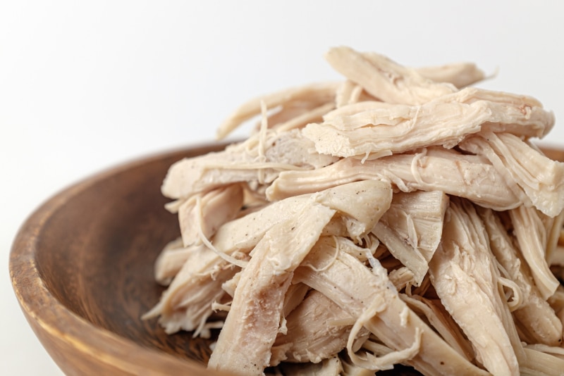 a bowl of boiled chicken breasts