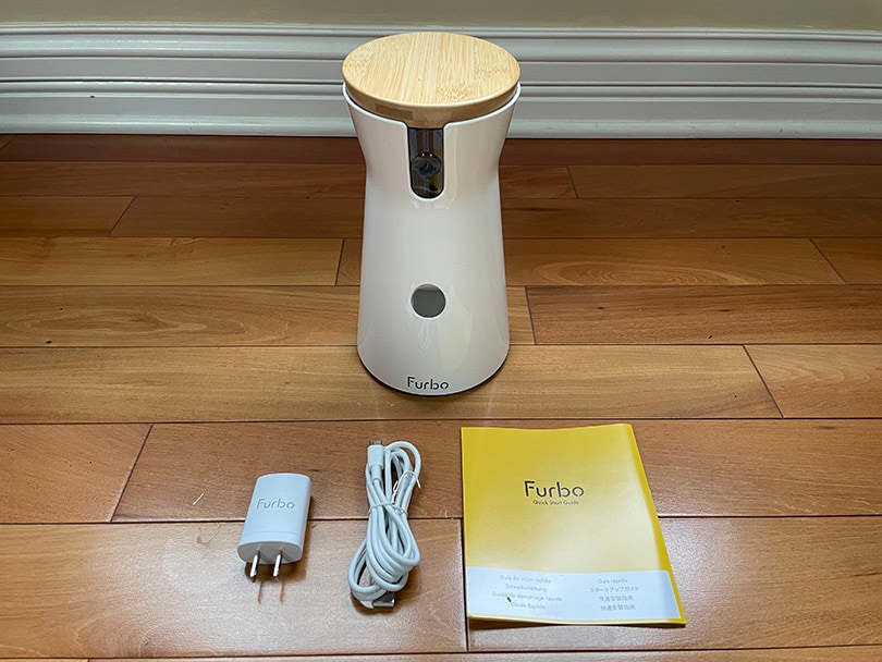 furbo 360 dog camer and accessories on the floor