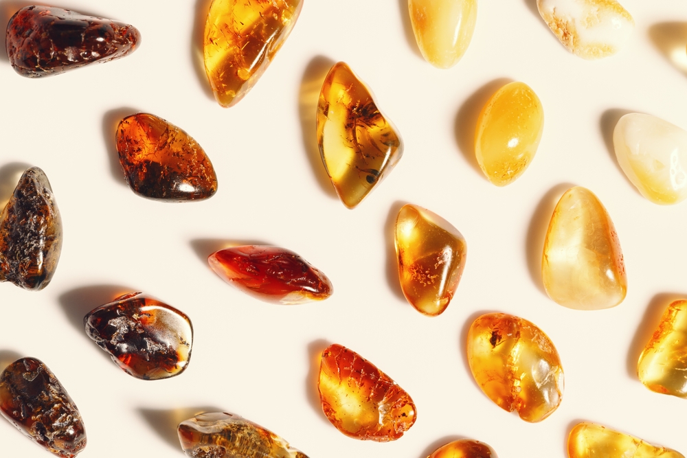Amber stones on beige background