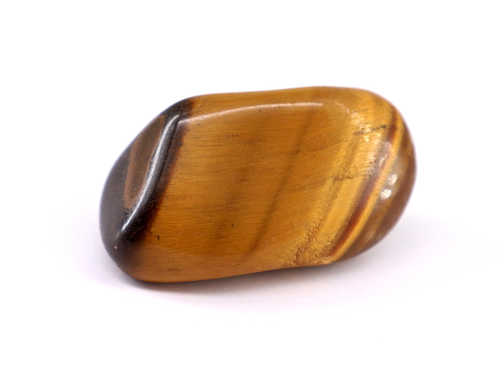 Tiger eye gemstone on white background